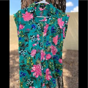 Express woman teal flower shirt.